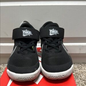 Nike Black and White Sneakers with Breathable Mesh and Textured Sole